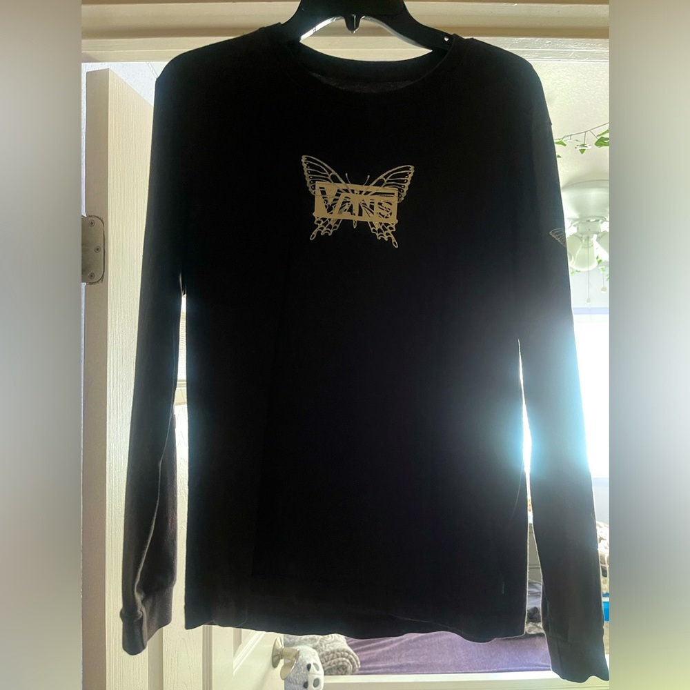 Long-sleeve tee, design is on both sleeves.